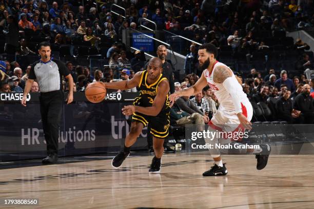 Chris Paul of the Golden State Warriors drives to the basket during the game against the Houston Rockets on November 20, 2023 at Chase Center in San...