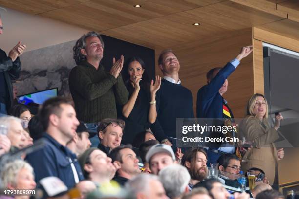 Prince Harry, The Duke of Sussex, and Meghan Markle, The Duchess of Sussex, celebrate a Vancouver Canucks goal during the third period of the NHL...