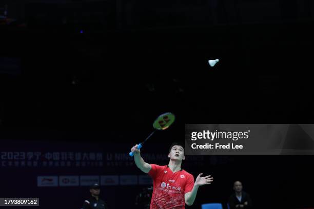 Brian Yang of Canada competes in the Men's Singles First Round match against Christo Popov of France during day one of the China Badminton Masters...
