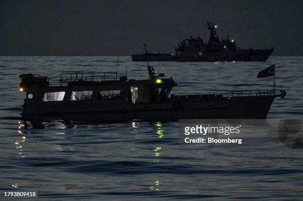 The Philippines' military-chartered boat, ML Kalayaan, and the BRP Melchora Aquino during the resupply mission to the Sierra Madre, early morning in...