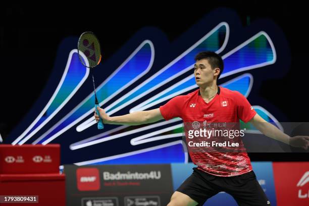 Brian Yang of Canada competes in the Men's Singles First Round match against Christo Popov of France during day one of the China Badminton Masters...
