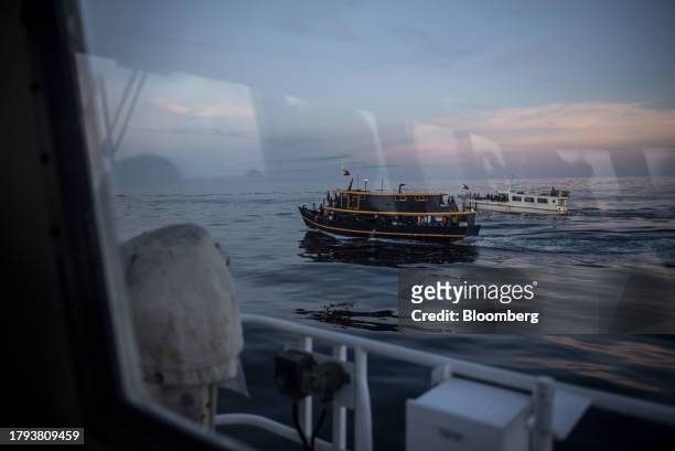The Philippine's military-chartered boats Unaizah Mae 1 and ML Kalayaan during a resupply mission for the BRP Sierra Madre, in the Second Thomas...