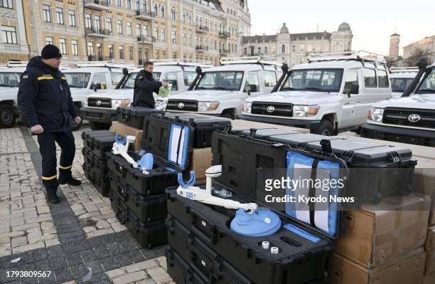 Photo taken on Nov. 20 in Ukraine's capital Kyiv shows landmine detectors and vehicles delivered by the Japan International Cooperation Agency to...