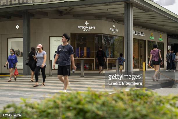 Shoppers on a pedestrian crossing on Scotts Road in Singapore, on Monday, Nov. 20, 2023. Singapore's gross domestic product figures for the third...