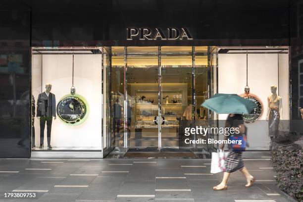 Shopper walks past a Prada SpA store on Orchard Road in Singapore, on Monday, Nov. 20, 2023. Singapore's gross domestic product figures for the third...