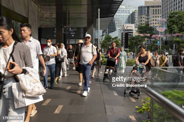 Pedestrians on Orchard Road in Singapore, on Monday, Nov. 20, 2023. Singapore's gross domestic product figures for the third quarter are scheduled to...