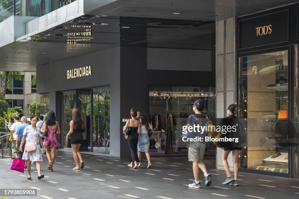 Shoppers pass window displays on Orchard Road in Singapore, on Monday, Nov. 20, 2023. Singapore's gross domestic product figures for the third...