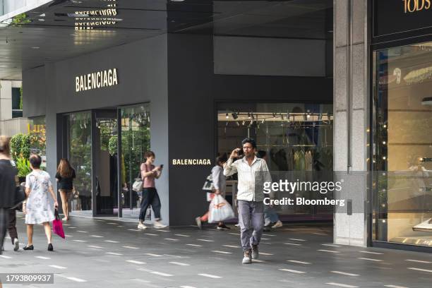 Shoppers pass window displays on Orchard Road in Singapore, on Monday, Nov. 20, 2023. Singapore's gross domestic product figures for the third...