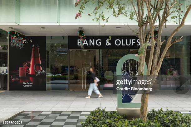 Shopper walks past a Bang & Olufsen A/S store on Scotts Road in Singapore, on Monday, Nov. 20, 2023. Singapore's gross domestic product figures for...
