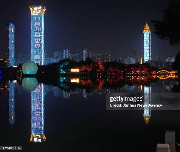 Buildings are lit up to celebrate World Children's Day in Wenzhou, east China's Zhejiang Province, Nov. 20, 2023.