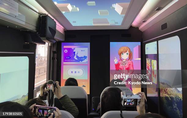 Photo taken on Nov. 21 shows the interior of a bus that provides virtual and augmented reality experience linked to the view from the windows...