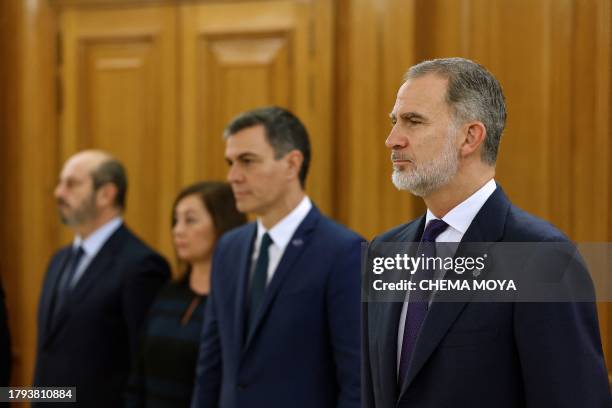 Spain's King Felipe VI and Spain's Prime Minister Pedro Sanchez take part in a ceremony for the newly-appointed ministers to be sworn in in front of...