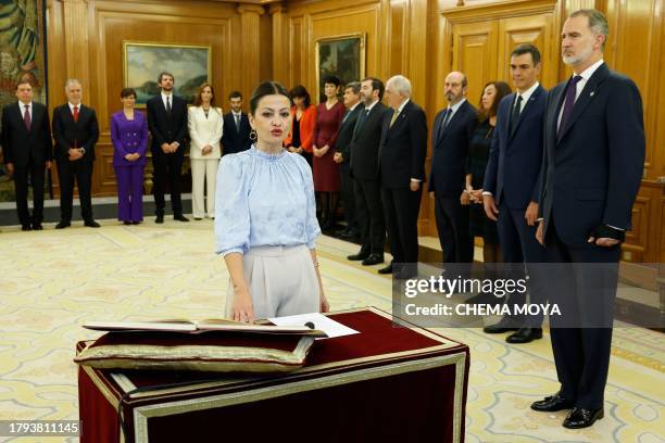 Spain's Minister of Childhood and Youth Sira Rego takes an oath on the constitution in front on Spain's King Felipe VI during a ceremony for the...