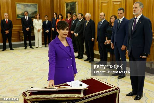 Spain's Minister of Housing and Urban Agenda Isabel Rodriguez takes an oath on the constitution in front on Spain's King Felipe VI during a ceremony...