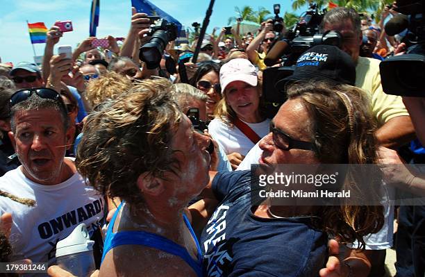 Diana Nyad gets a hug from her trainer Bonnie Stoll after finishing her historic swim from Havana, Cuba, to Key West, Florida, Monday, September 2,...