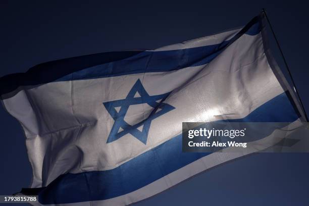 An Israel flag flies during the March for Israel on the National Mall November 14, 2023 in Washington, DC. The large pro-Israel gathering comes as...