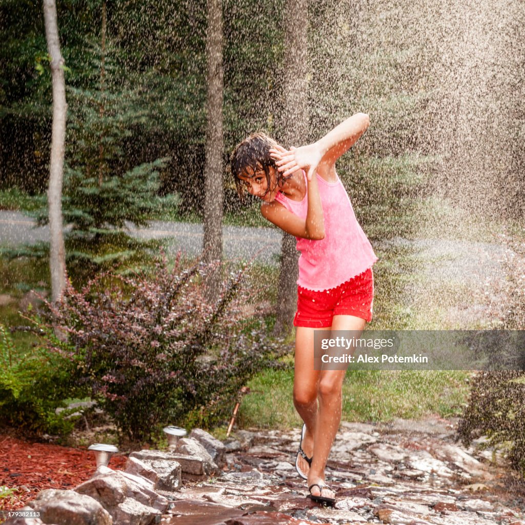 Girl seek shelter under a summer rain