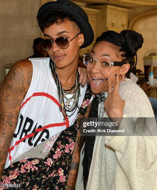 Model AzMarie Livingston and actress Raven-Symone attend Neuro Drinks At LudaDay Weekend Celebrity Pool Party on September 2, 2013 in Atlanta,...