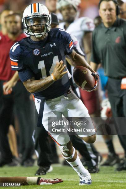 Quarterback Nick Marshall of the Auburn Tigers runs the ball downfield during their game against the Washington State Cougars on August 31, 2013 at...