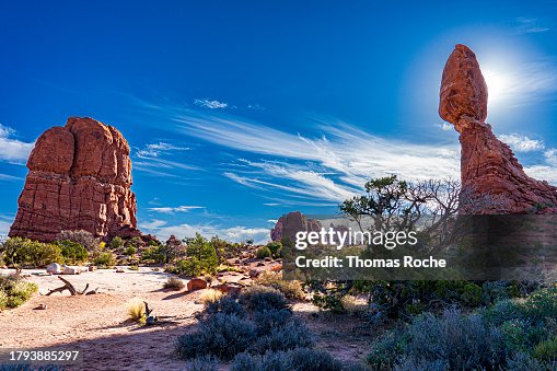 The sun behind the Balanced Rock