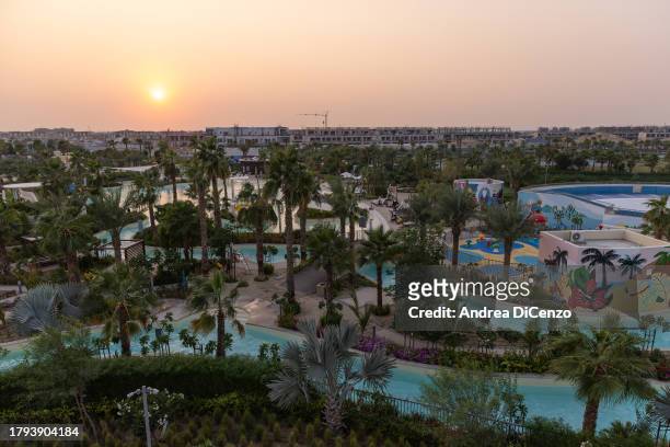 Sun sets over Damac Hills 2, a family friendly community in the desert which has been fitted out with lush green lawns, greenery, and a water park...