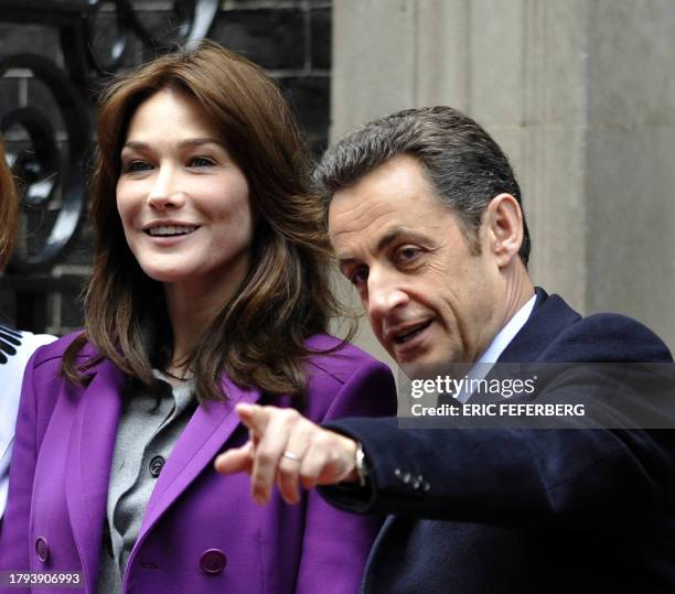 French President Nicolas Sarkozy and his wife Carla Bruni-Sarkozy are welcomed by British Prime Minister Gordon Brown outside 10 Downing Street in...