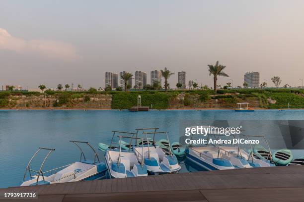 Freshwater lagoon at Damac Hills 2, a family friendly community in the desert which has been fitted out with lush green lawns, greenery, and a water...