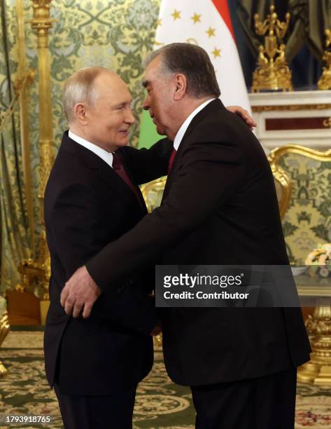 Russian President Vladimir Putin embraces Tajik President Emomali Rakhmon at the Grand Kremlin Palace on November 21 in Moscow, Russia. President of...