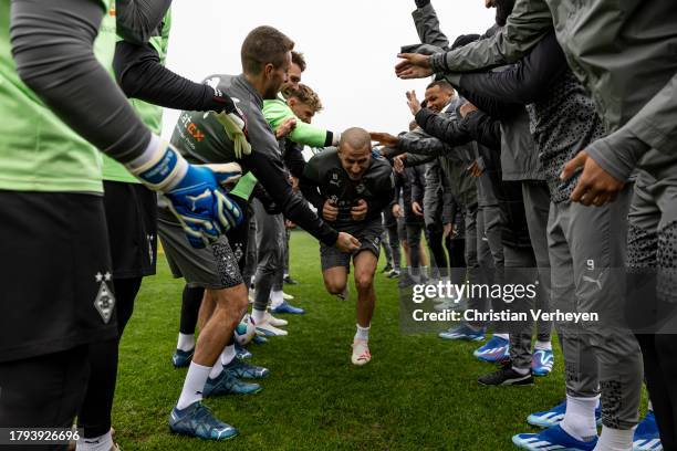 The Team of Borussia welcomes Stefan Lainer back to training after recovering from cancer during a training session of Borussia Moenchengladbach at...