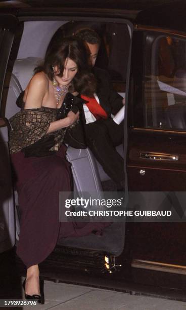 France's President Nicolas Sarkozy and his wife Carla Bruni-Sarkozy arrive for a state banquet at the Guildhall in London, on March 27, 2008. France...