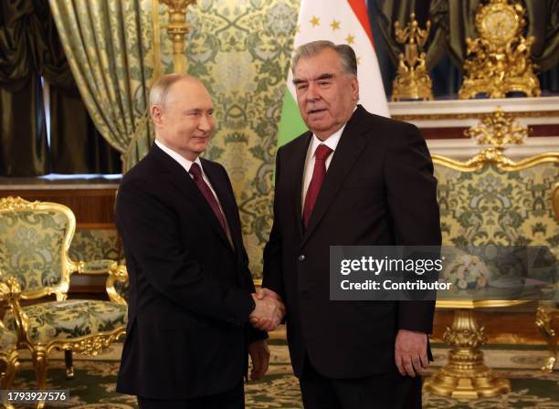 Russian President Vladimir Putin greets Tajik President Emomali Rakhmon at the Grand Kremlin Palace on November 21 in Moscow, Russia. President of...