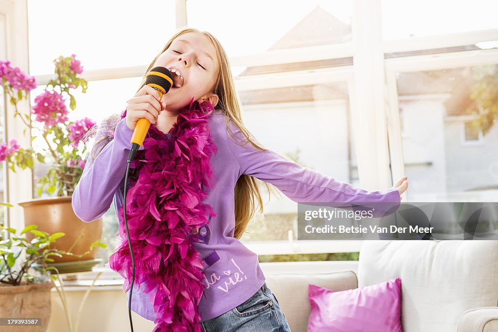 Girl Signing Young Girl Singing Kareoke At Home High-Res Stock Photo - Getty Images