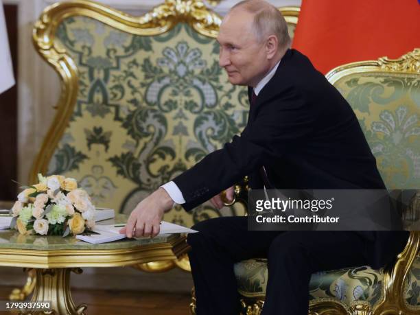Russian President Vladimir Putin smiles during Russian-Tajik talks at the Grand Kremlin Palace on November 21 in Moscow, Russia. President of...