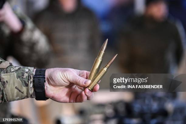 Soldier presents ammunition for assault weapons during the visit by the German and the Ukrainian Defence Ministers of a training facility ouside Kyiv...