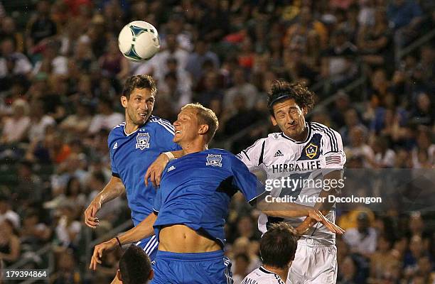 Clarence Goodson and Steven Lenhart of San Jose Earthquakes and Omar Gonzalez of Los Angeles Galaxy vie for the corner kick in the first half during...