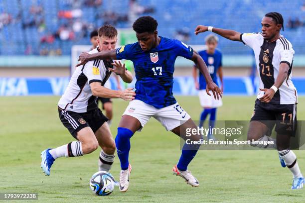 Keyrol Figueroa of United States dribbles Finn Jeltsch of Germany during FIFA U-17 World Cup Round of 16 match between Germany and USA at Si Jalak...