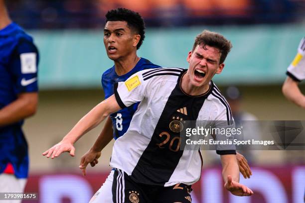 Robert Ramsak of Germany is challenged by Pedro Soma of United States during FIFA U-17 World Cup Round of 16 match between Germany and USA at Si...