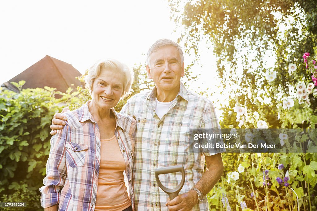 Portrait of mature couple in garden.