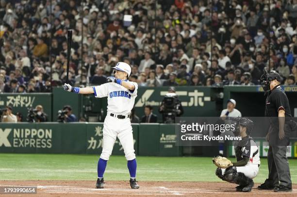 Former Seattle Mariners outfielder Ichiro Suzuki bats during a game between his amateur baseball team Kobe Chiben and a team of selected high school...