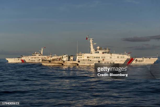 China Coast Guard ships during a resupply mission for the BRP Sierra Madre, in the Second Thomas Shoal in the disputed South China Sea, on Friday,...