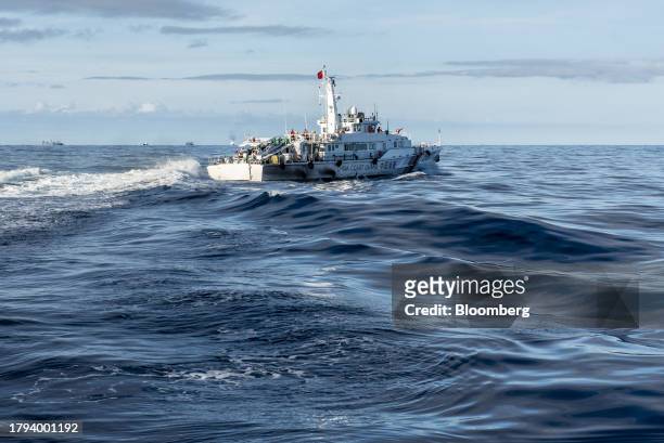China Coast Guard ship during a resupply mission for the BRP Sierra Madre, in the Second Thomas Shoal in the disputed South China Sea, on Friday,...