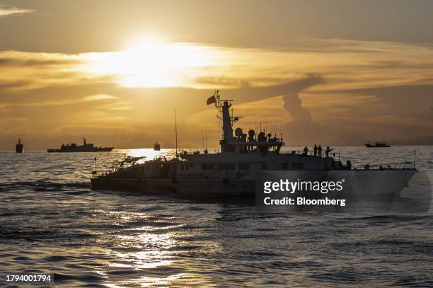 China Coast Guard ships along with other Chinese fishing vessel, which Manila calls maritime militia vessel, during a resupply mission for the BRP...