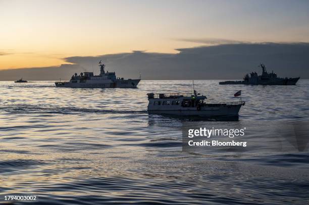 Philippines' military-chartered boat, ML Kalayaan and BRP Melchora Aquino surrounded by China Coast Guard ships during a resupply mission for the BRP...