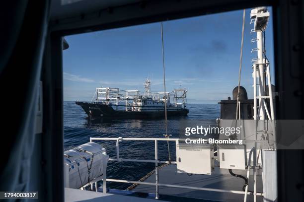 Chinese fishing vessel, which Manila calls maritime militia, as seen from the BRP Sindangan, during a resupply mission for the BRP Sierra Madre, in...