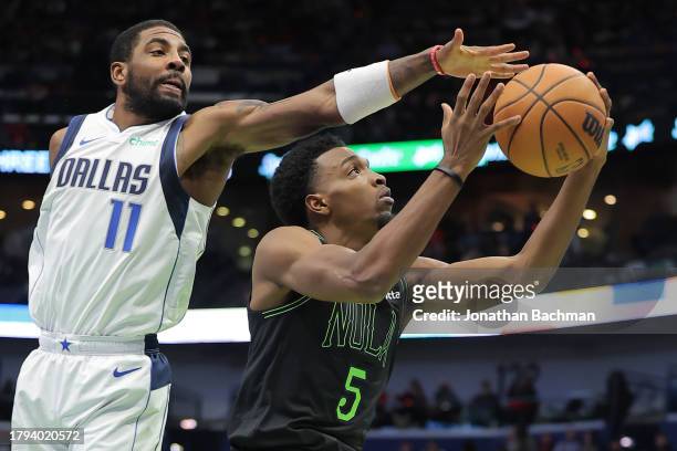 Herbert Jones of the New Orleans Pelicans shoots against Kyrie Irving of the Dallas Mavericks during the first half of the the NBA In-Season...