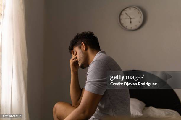 tired man just woke up. concept of low energy and sleeplessness. - endast män bildbanksfoton och bilder