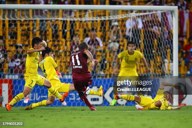 Leandro of Vissel Kobe shoots at goal while Kashiwa Reysol defense attempts to block during the J.League J1 second stage match between Kashiwa Reysol...