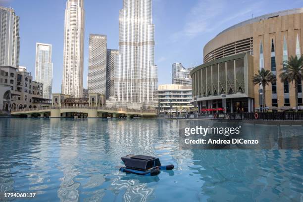 Aquatic drone helps clean the fresh water pool outside Dubai Mall on November 15, 2023 in Dubai, United Arab Emirates. In the UAE, where 42 percent...