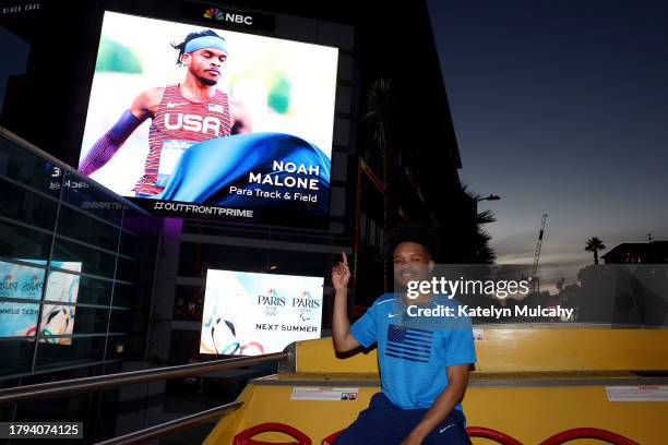 Paralympian Noah Malone of Fishers, Indiana, poses with his sign on the Sunset Strip during the Team USA Road to Paris Bus Tour on November 14, 2023...