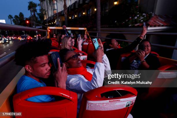Paralympian Noah Malone of Fishers, Indiana, sees his sign on the Sunset Strip during the Team USA Road to Paris Bus Tour on November 14, 2023 in Los...